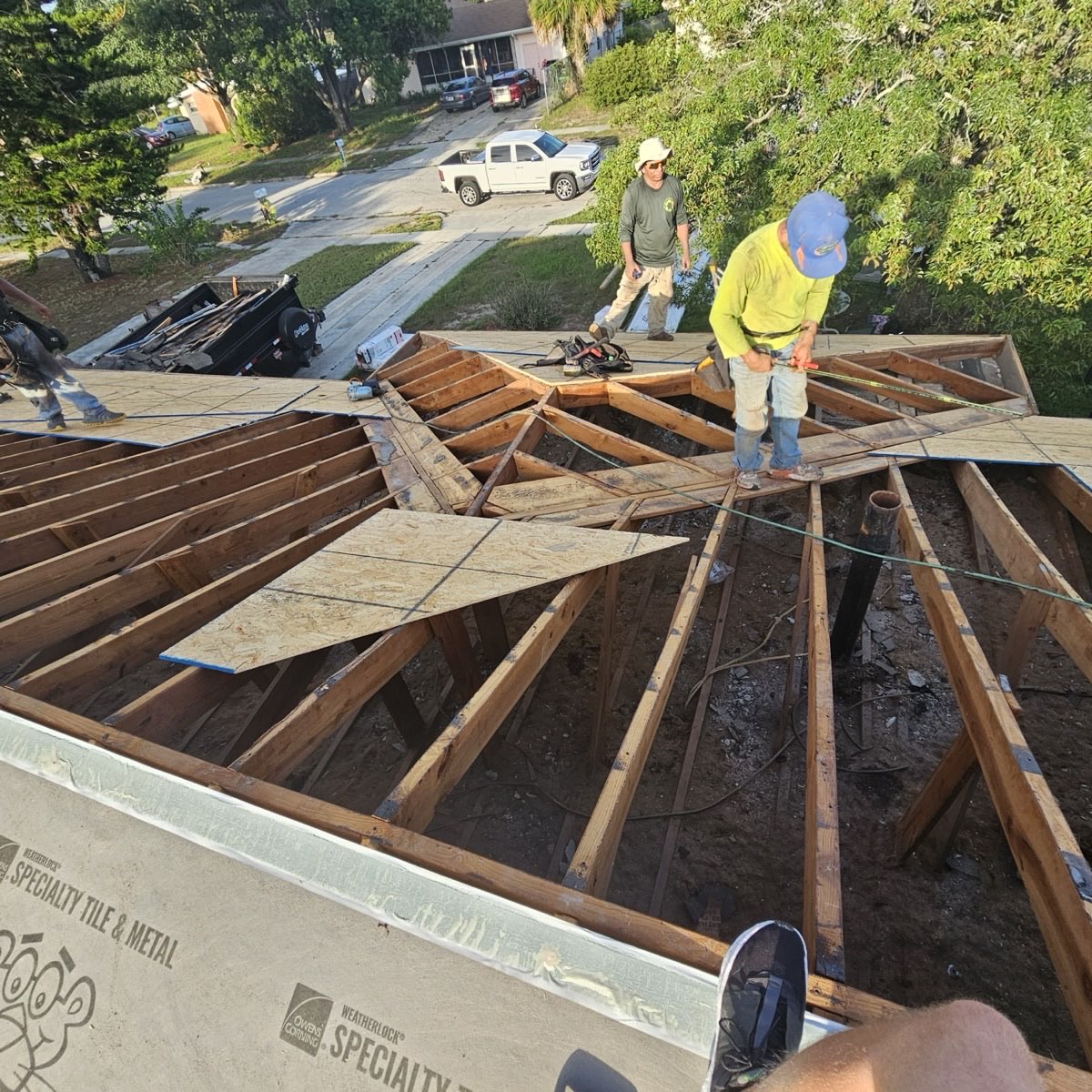 Roof deck attachment inspection showing plywood and nail pattern