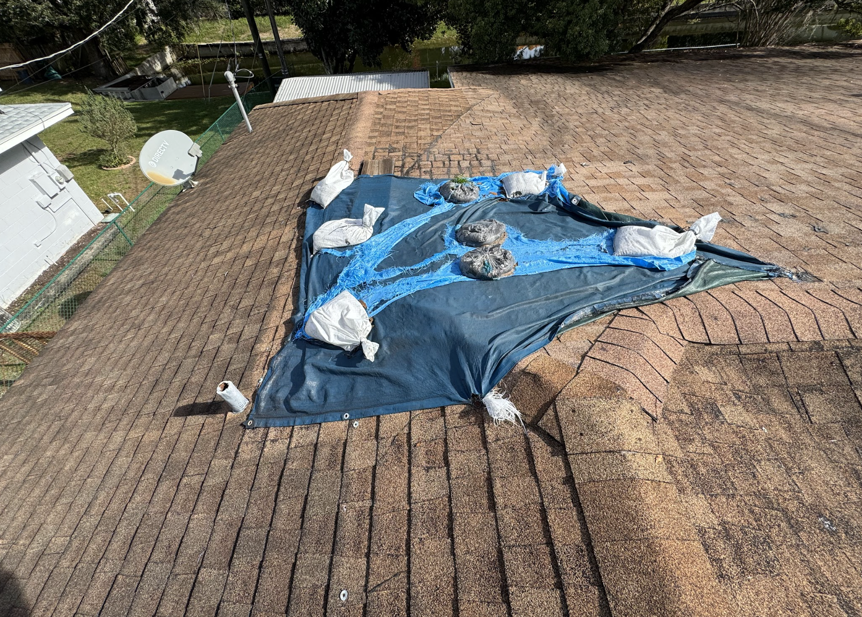 Emergency roof tarping after storm damage in Polk County FL